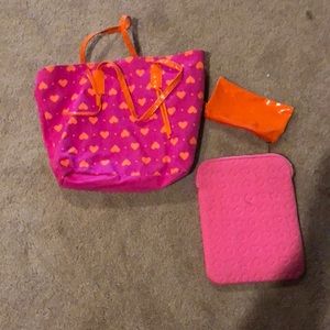 Pink bag with a makeup pouch and a tablet case